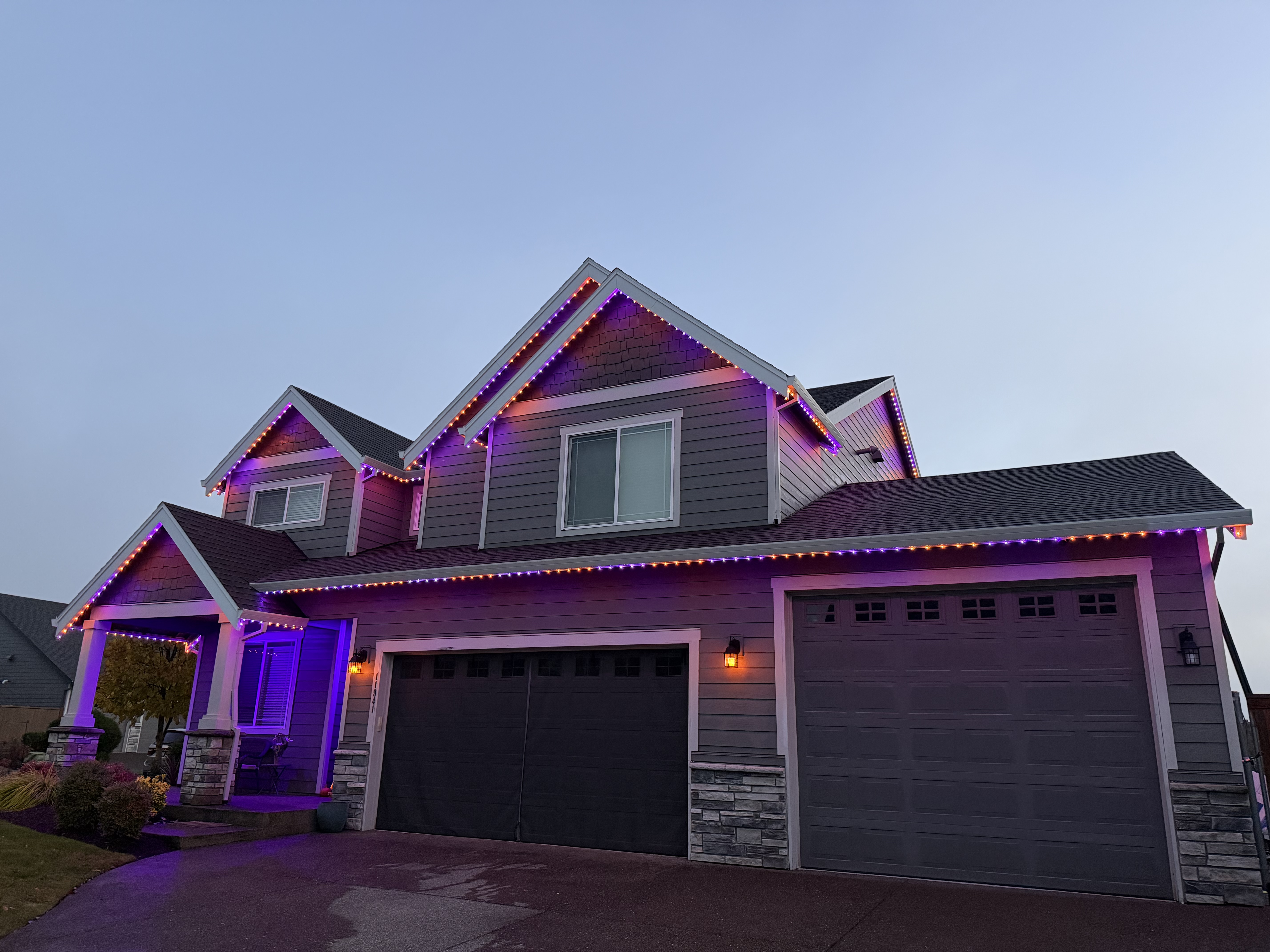 Home with roofline lighting installation