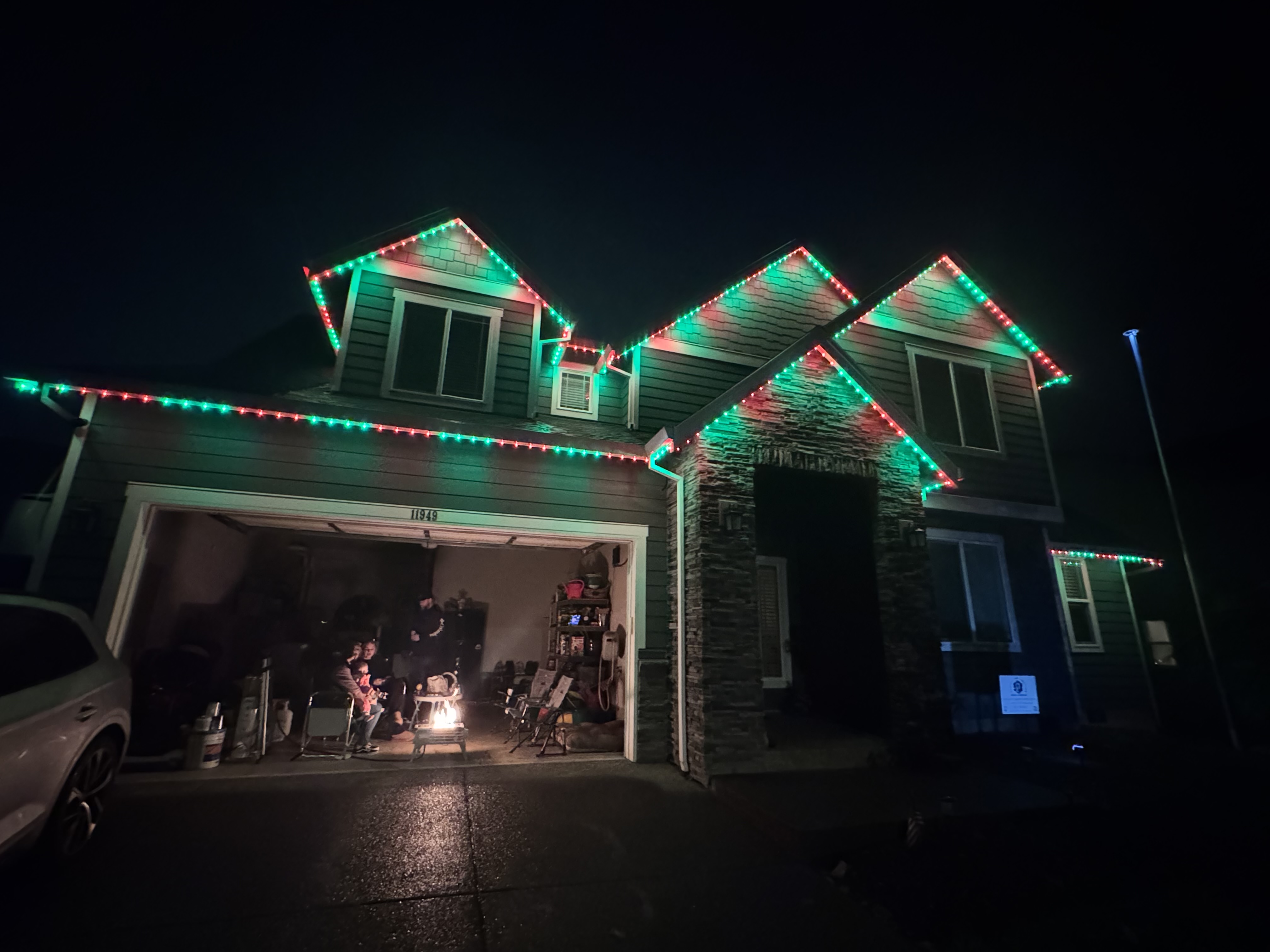 Neighborhood home with permanent roofline lights